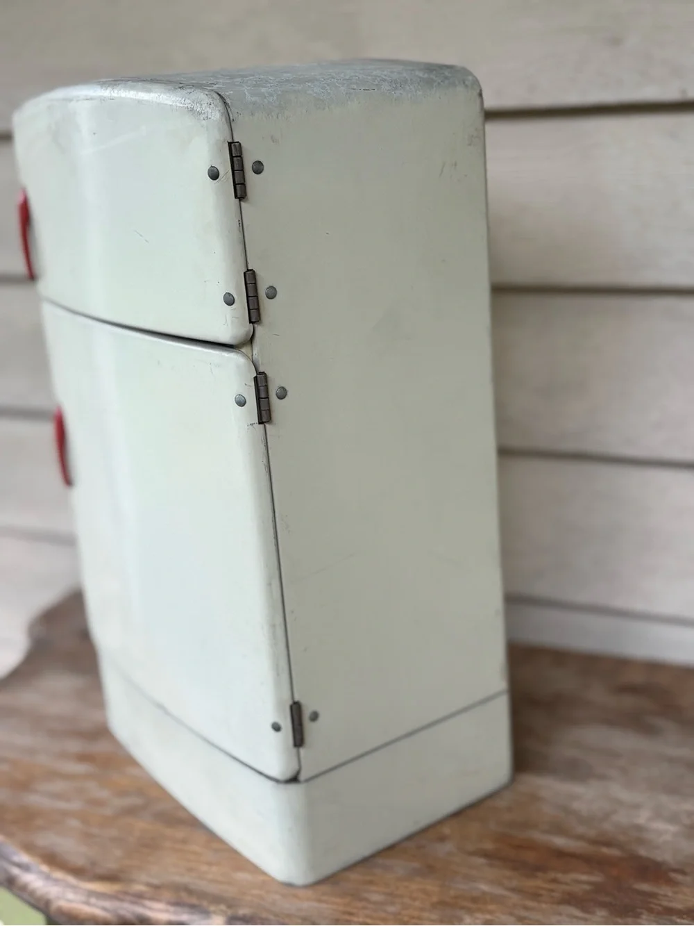 VTG 1950s Wolverine Supply metal toy refrigerator, featuring a white finish